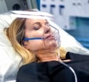 Close-up of Female Wearing Oxygen Mask While Inside a Sechrist Hyperbaric Chamber