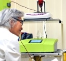 Dr. Alice Pien speaking with a patient while they receive a high dose ozone therapy treatment.