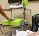 A patient has an IV in arm during her ozone therapy treatment.