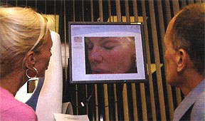 Bree Walker and Asher Milgrom PhD examine her computerized complexion analysis prior to the laser face lift procedure.