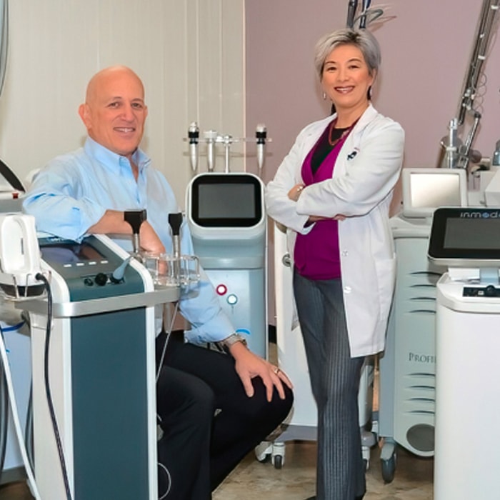 Dr. Alice Pien and Dr. Asher Milgrom with their 30+ lasers.
