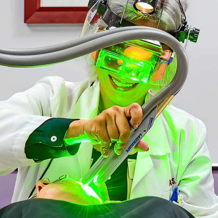 Dr. Alice Pien performing SpectraLift laser facelift on patient.